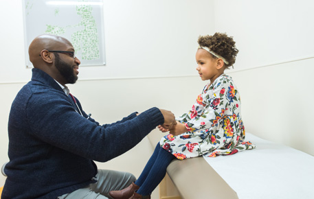 pediatrician with little girl