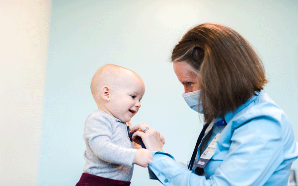 doctor examines baby