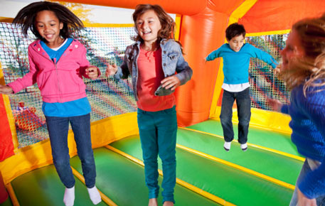 kids jumping in bouncy house