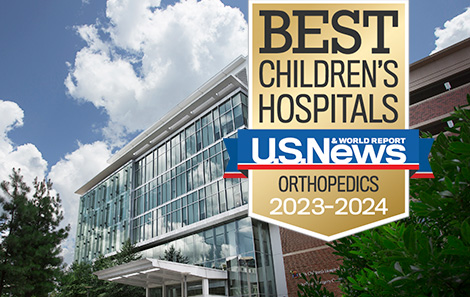 2023 Top ranking orthopedics badge over image of UVA Children's Hospital
